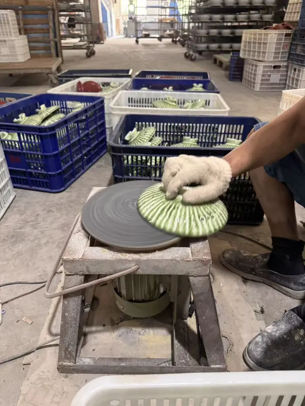 Glazed lids finished by hand on the wheel.